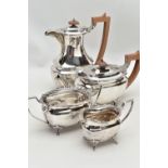 A FOUR PIECE SILVER TEA SERVICE OF SHAPED OVAL FORM, comprising tea pot, hot water jug, milk jug and