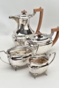 A FOUR PIECE SILVER TEA SERVICE OF SHAPED OVAL FORM, comprising tea pot, hot water jug, milk jug and