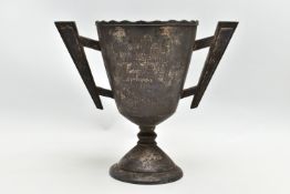 A GEORGE V SILVER TWIN HANDLED TROPHY CUP, wavy rim over a conical body with angular handles, the
