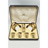 A CASED SET OF SIX AYNSLEY COFFEE CANS IN SILVER GILT SLEEVES AND SIX SAUCERS, printed with a