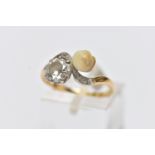 AN EARLY 20TH CENTURY 18CT GOLD DIAMOND AND PEARL DRESS RING, of crossover design, set with an early