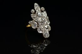 AN EARLY 20TH CENTURY DIAMOND DRESS RING, comprised of seventeen old cut diamonds ranging in size,
