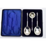 A CASED SILVER SERVING SET, three silver apostle spoons to include one sifter spoon and two