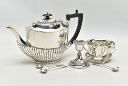 A GEORGE V SILVER TEA POT OF OVAL FORM, domed cover with reeded detail, ebonised fitments, the lower