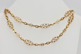 A YELLOW METAL NECKLACE, designed as a series of openwork scrolling links with hook clasp,