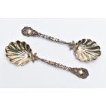 A PAIR OF LATE VICTORIAN SILVER SERVING SPOONS, each with a shell shape bowl, floral and foliate