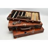 AN EARLY 20TH CENTURY MAHOGANY CASED OPTOMETRIST SET, the interior fitted with a selection of lenses
