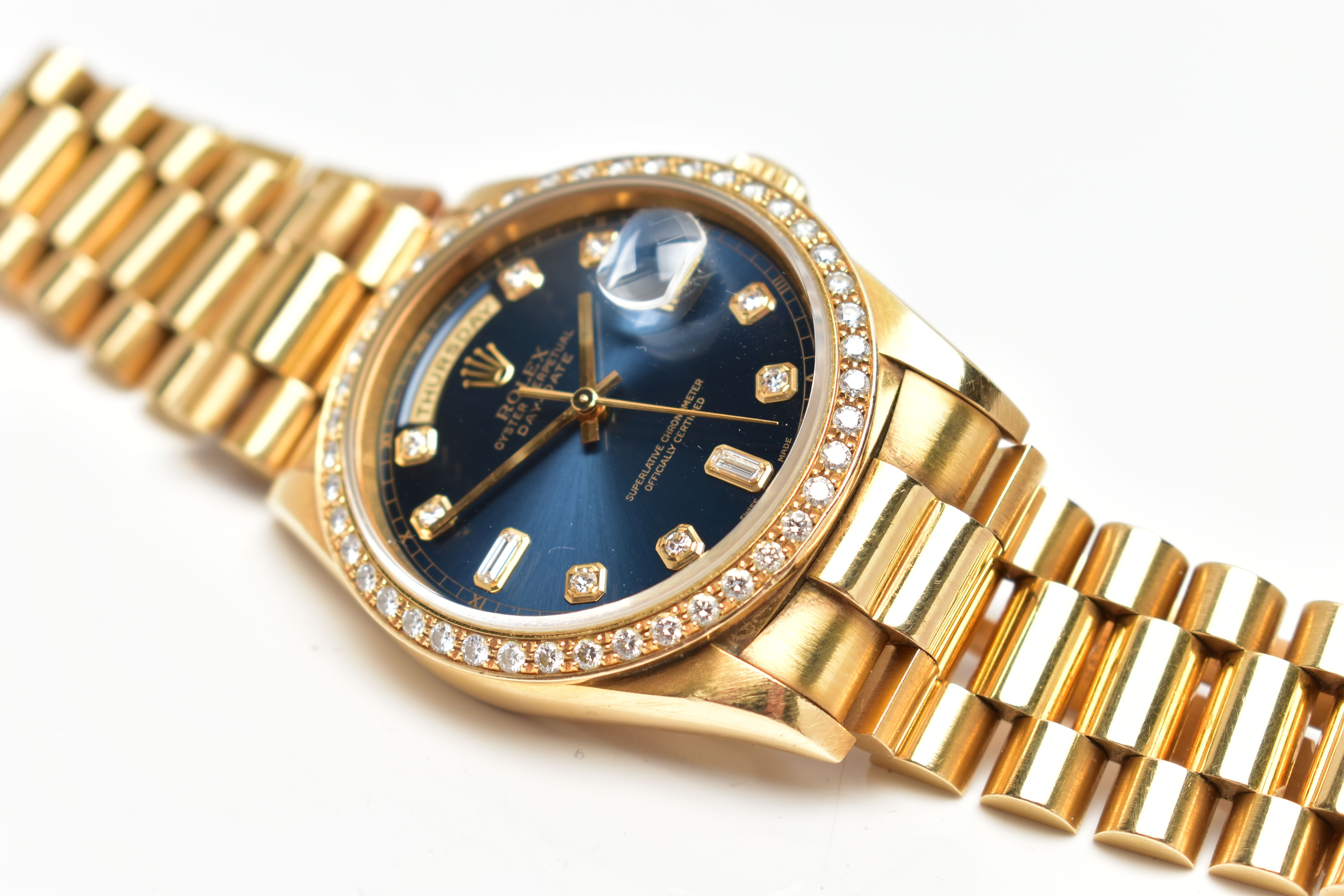 AN 18CT YELLOW GOLD AND DIAMOND DAY-DATE ROLEX WRISTWATCH, the dark blue dial with diamond dot - Image 8 of 15