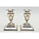 A PAIR OF LATE VICTORIAN SILVER DWARF CANDLESTICKS, beaded rims throughout, the urn shaped
