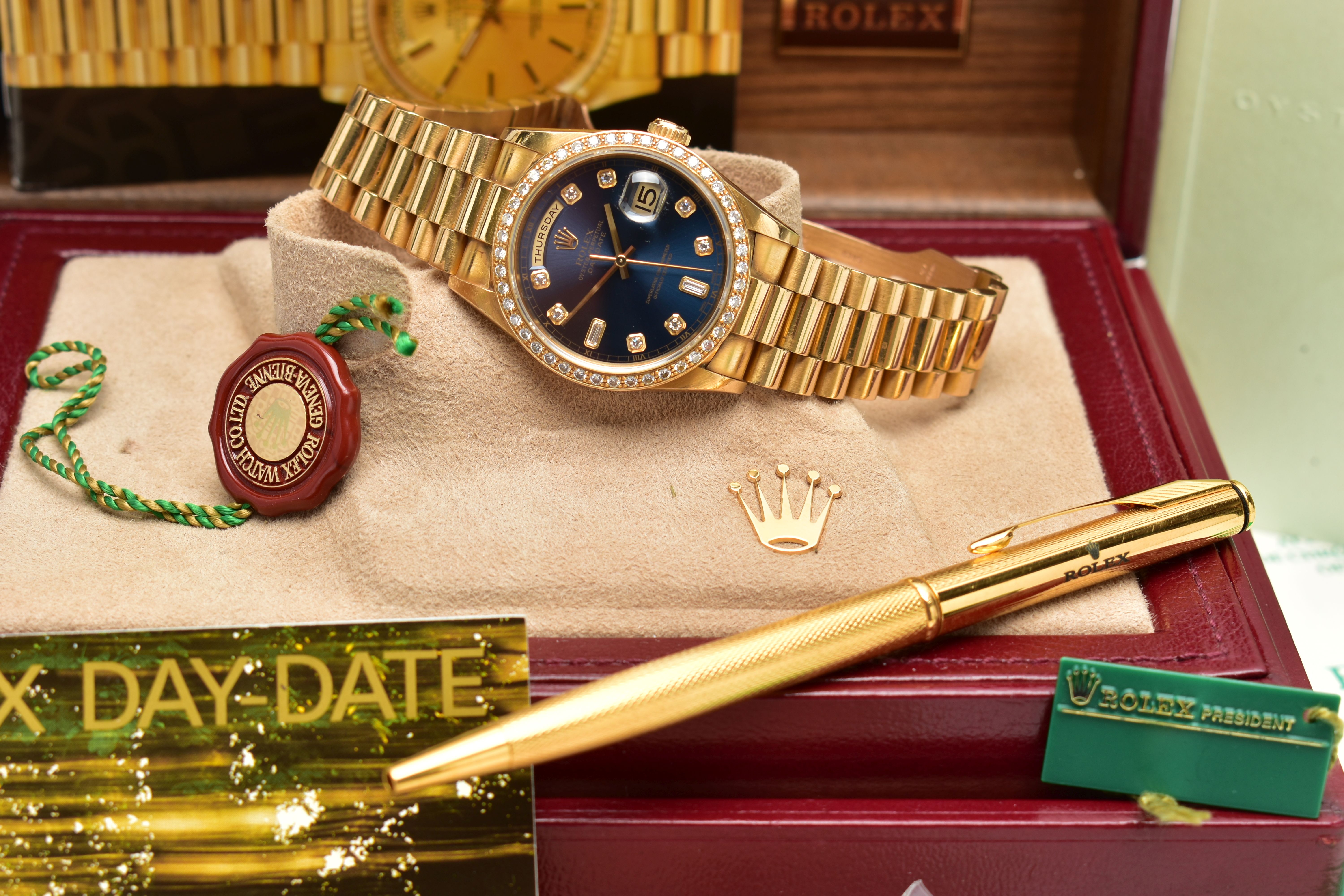 AN 18CT YELLOW GOLD AND DIAMOND DAY-DATE ROLEX WRISTWATCH, the dark blue dial with diamond dot - Image 10 of 15