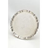 A GEORGE VI SILVER TRAY WITH CHIPPENDALE STYLE PIE CRUST RIM, plain to the centre, makers Barker