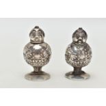 A PAIR OF GEORGE V SILVER NOVELTY SALT AND PEPPER POTS IN THE FORM OF 'LITTLE TOM TUCKER', the
