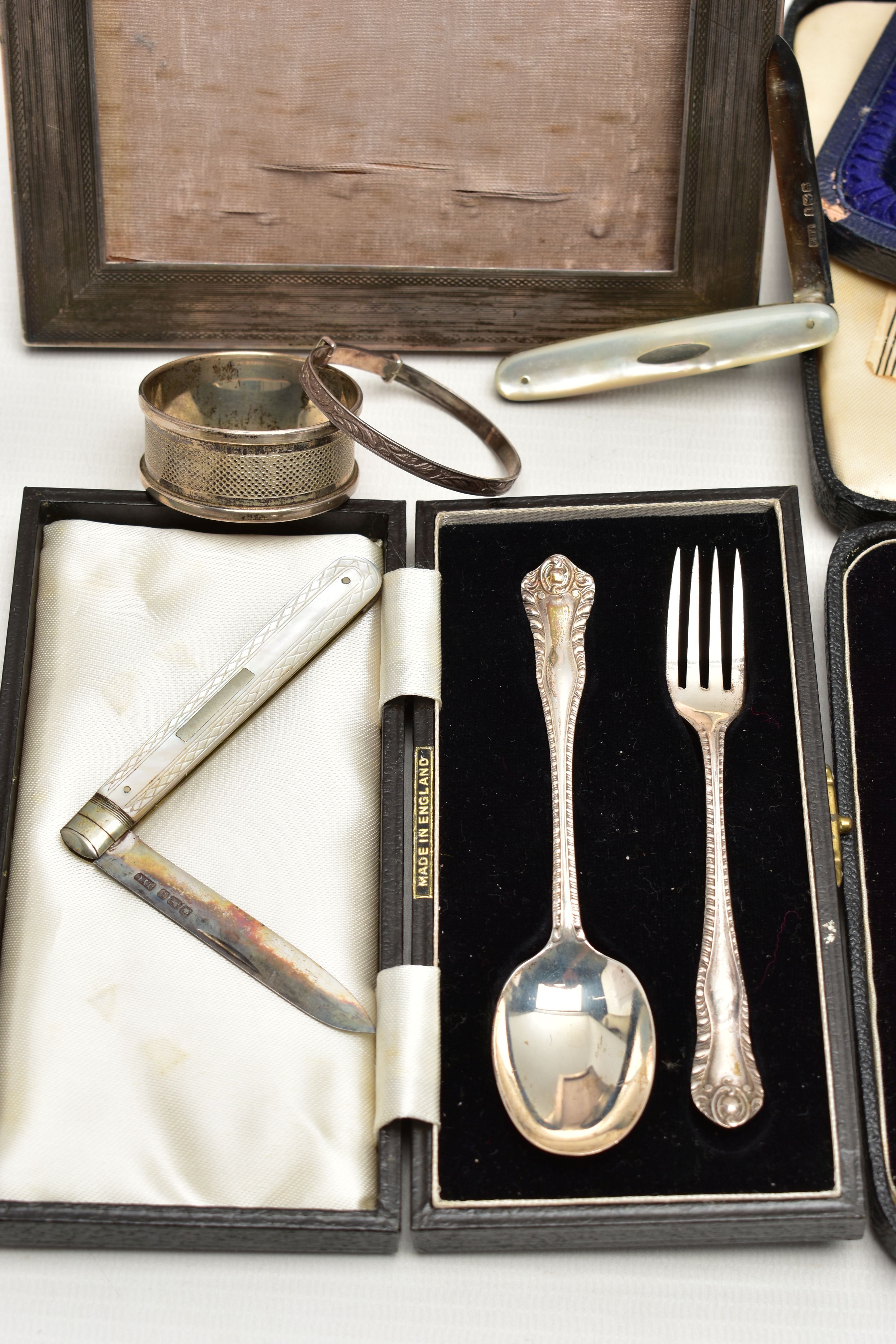 A GROUP OF CASED AND LOOSE SILVER, comprising a rectangular photograph frame, engine turned - Image 3 of 9