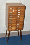 OPTOMETRIST INTEREST: A 1960'S /70'S TEAK CHEST OF TWENTY-FOUR SHORT DRAWERS, each drawer with