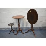 A 20TH CENTURY VICTORIAN STYLE MAHOGANY TRIPOD TABLE, with a circular top, and barley twist support,