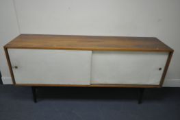 ROBIN DAY (1915-2010) FOR HILLE, A MID-CENTURY ROSEWOOD SIDEBOARD, the double white sliding doors