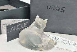 A BOXED LALIQUE HAPPY CAT, serial number 1179500, modelled as a recumbent cat, etched mark to