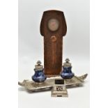 AN ARTS AND CRATFS COPPER MANTEL CLOCK, the shaped rectangular case embossed with planished style