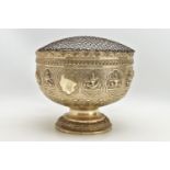 A LATE 19TH / EARLY 20TH CENTURY INDIAN WHITE METAL ROSE BOWL, repousse decorated with a rim of