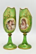 A PAIR OF 19TH CENTURY BOHEMIAN GREEN AND GILT GLASS PEDESTAL EWERS OF HELMET FORM, each with a