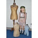 A SECOND HALF 20TH CENTURY YOUNG GIRL PLASTIC SHOP MANNEQUIN ON A GLASS BASE, dressed as a 1940's