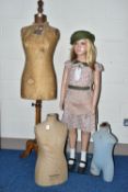 A SECOND HALF 20TH CENTURY YOUNG GIRL PLASTIC SHOP MANNEQUIN ON A GLASS BASE, dressed as a 1940's