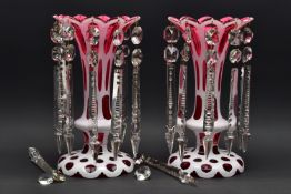 A PAIR OF LATE 19TH CENTURY CRANBERRY AND WHITE OVERLAID LUSTRES, frilled rim over oval and circular