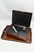 AN EARLY 20TH CENTURY OAK TWIN HANDLED TRAY AND A VICTORIAN WALNUT WRITING SLOPE, the tray has