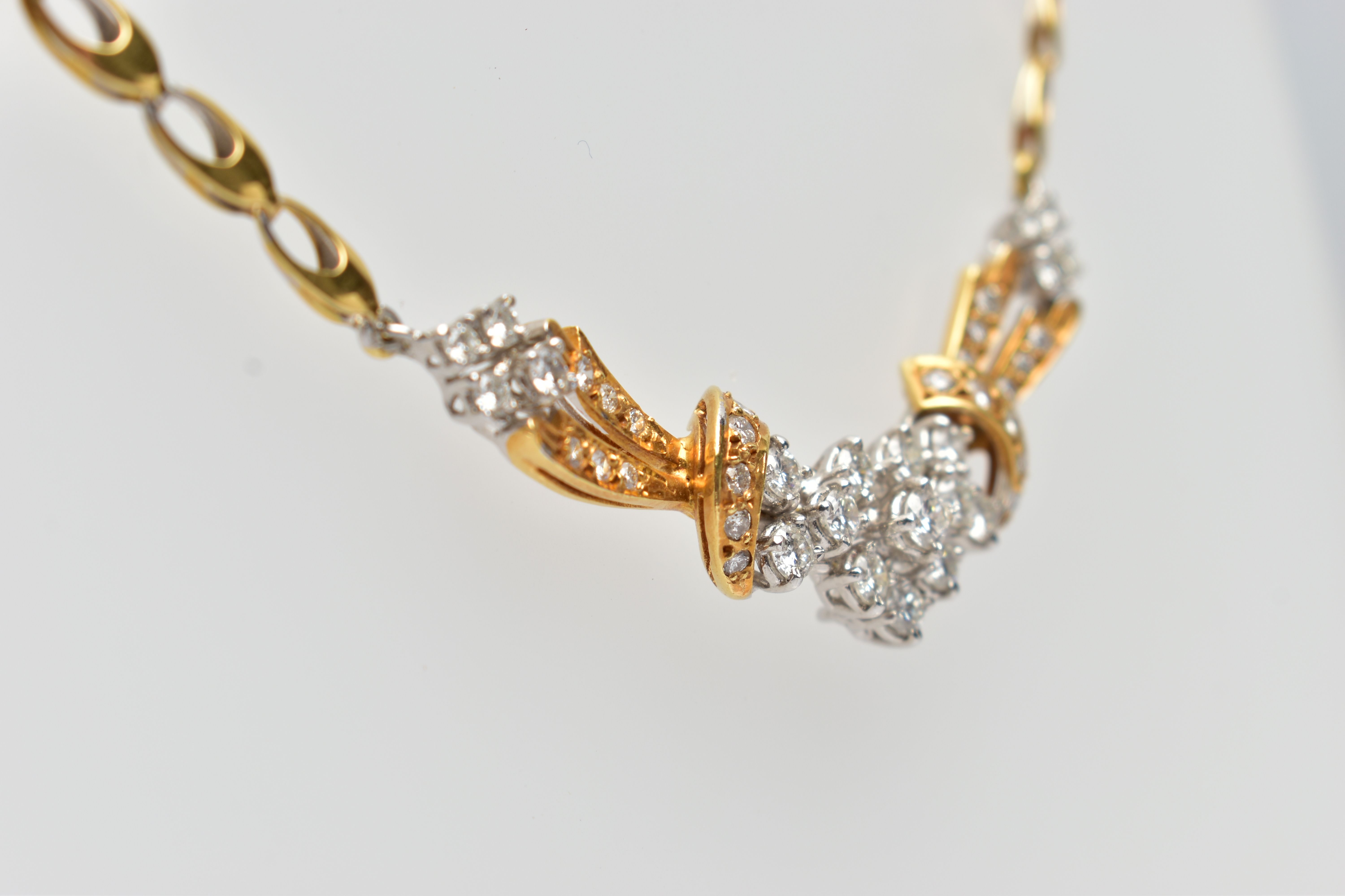 A YELLOW AND WHITE METAL DIAMOND NECKLACE, the front designed as an openwork panel set throughout - Image 4 of 8