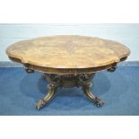 A VICTORIAN BURR WALNUT CENTRE TABLE, the wavy top that's quarter veneered with a moulded edge, on a
