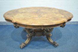 A VICTORIAN BURR WALNUT CENTRE TABLE, the wavy top that's quarter veneered with a moulded edge, on a