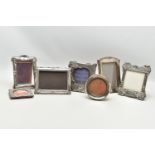 SEVEN ASSORTED SILVER PHOTOGRAPH FRAMES, rectangular and circular apertures, mostly Edwardian in