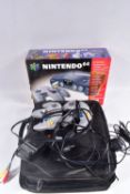 TWO BOXED NINTENDO 64 CONSOLES, CONTROLLERS AND A QUANTITY OF GAMES, N64s that are boxed are not the