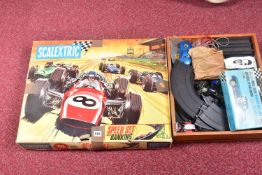 A SCALEXTRIC 12E SET, speed set with banking, box in a distressed condition, appears well kitted out
