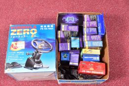 A QUANTITY OF GAME CONSOLE ACCESSORIES, including third party controllers, a racing wheel for the
