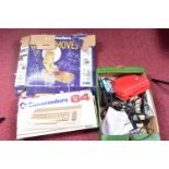 A BOXED COMMODORE 64 (C64 MODEL), ACCESSORIES AND A QUANTITY OF GAMES, accessories include a