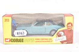 A BOXED CORGI TOYS FORD CORTINA GXL, No.313, Whizzwheels, metallic blue body with black body,