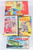 FOUR VINTAGE CHILDRENS TOYS, to include a Toy Town telephone exchange, red tinplate,