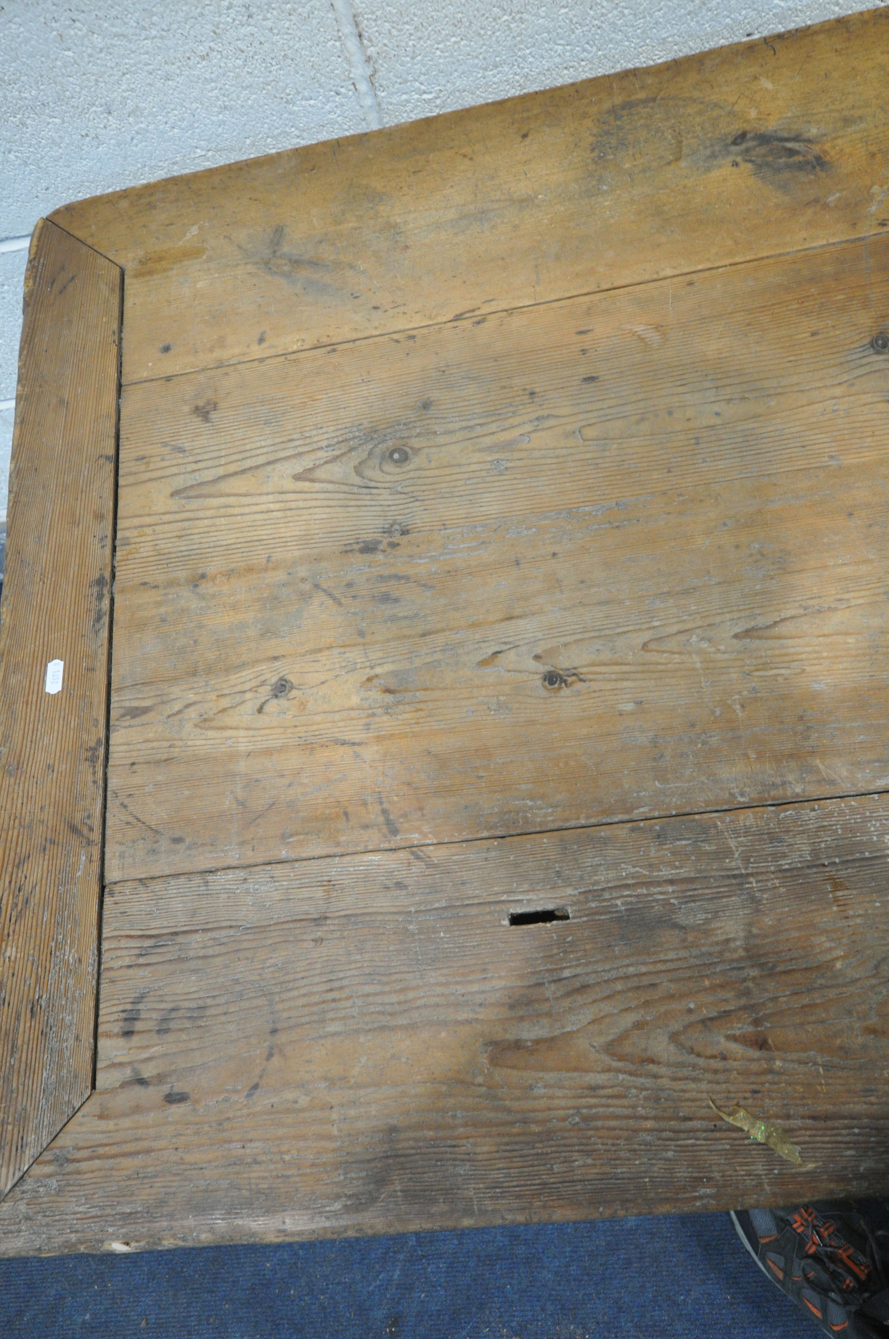 A 19TH CENTURY FARMHOUSE TABLE, the pine top with penny slots, three frieze drawers, on an oak base, - Image 4 of 6