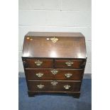 A GEORGIAN OAK BUREAU, with a fitted interior, over four drawers, on bracket feet, width 84cm x