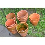 TWELVE MODERN TERRACOTTA PLANT POT the largest pair being 31cm in dimeter, the rest are very similar