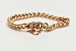 A YELLOW METAL CURB LINK BRACELET, polished yellow metal, fitted with an integrated box clasp with a