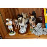 A COLLECTION OF BULL MASTIFF DOG FIGURINES, comprising a bronzed effect figure of a girl reading