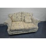A BEIGE FLORAL UPHOLSTERED TWO SEATER SETTEE, length 161cm (condition:-discoloured to both