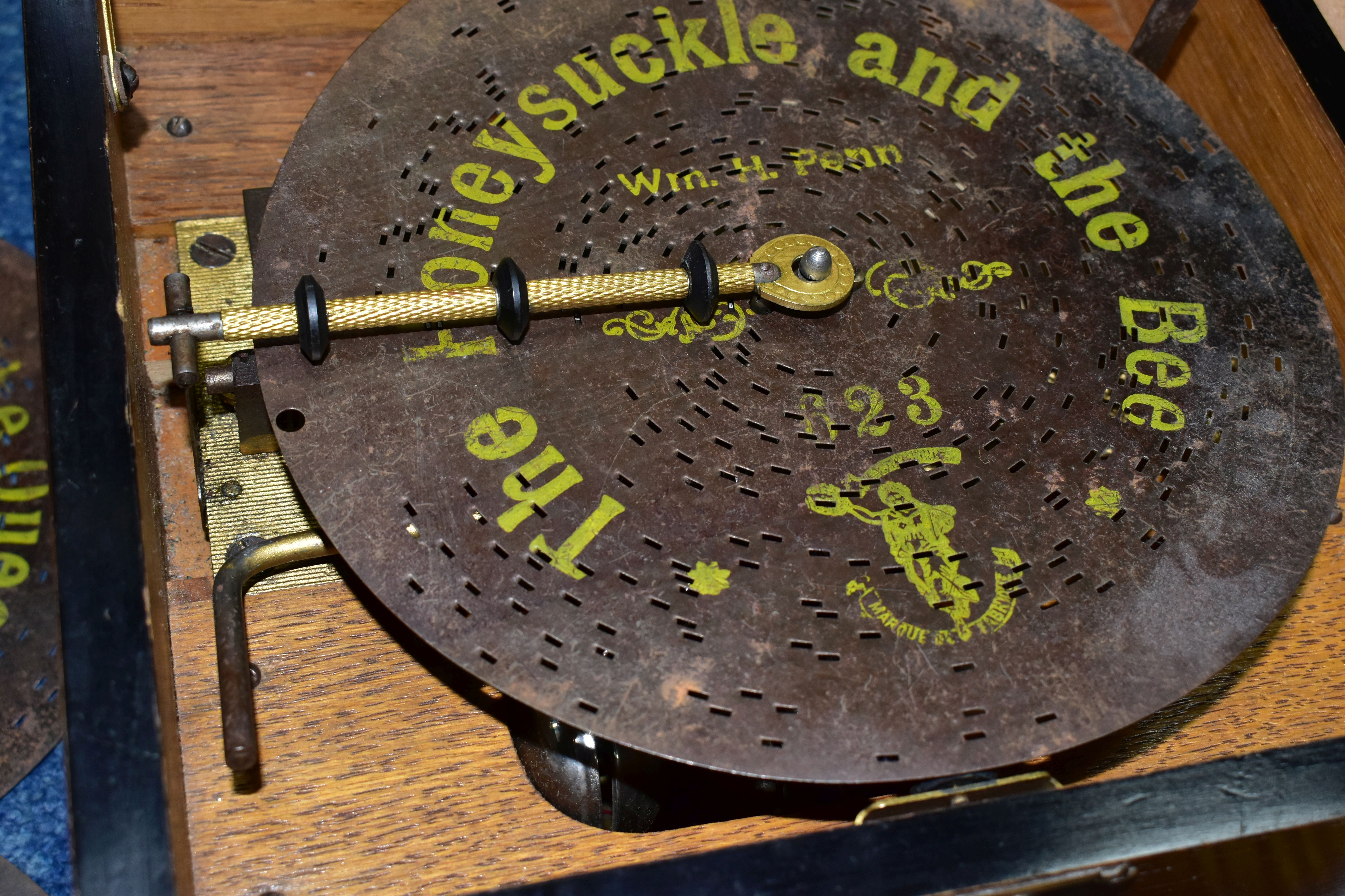 AN EARLY 20TH CENTURY POLYPHON, fitted with six bells, complete with twelve 8 discs - Image 4 of 8