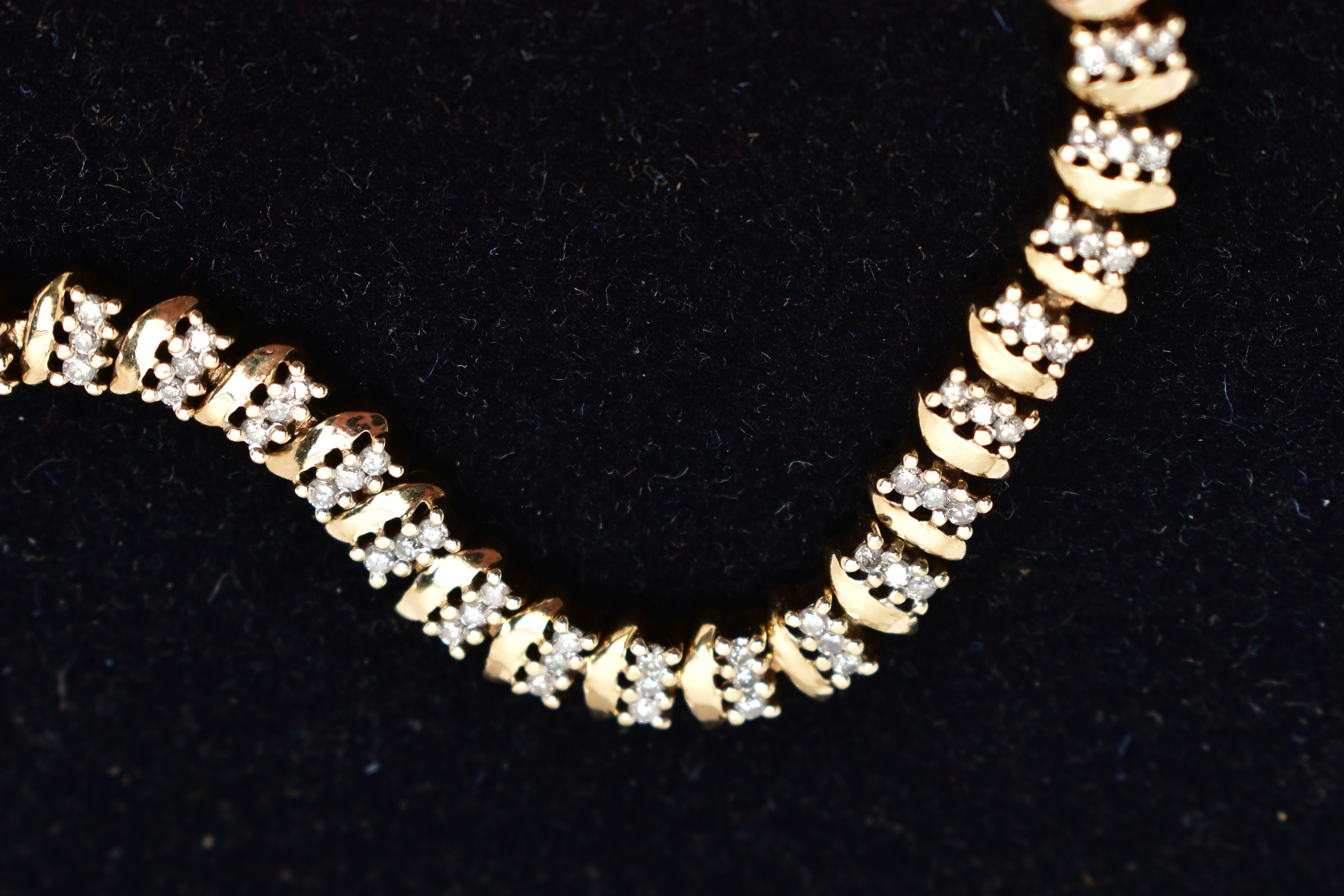 A 9CT GOLD DIAMOND LINE BRACELET, three round brilliant cut diamonds prong set alongside a yellow - Image 4 of 6