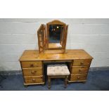 A PINE DRESSING TABLE, with two banks of three drawers, length 144cm x depth 48cm x height 73cm,