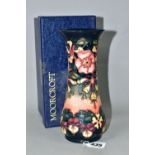 A BOXED MOORCROFT POTTERY OBERON PATTERN VASE, of waisted form, with tube lined flowers and