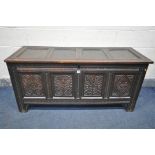 A GEORGIAN CARVED OAK PANELLED COFFER, length 141cm x depth 53cm x height 66cm (condition:-