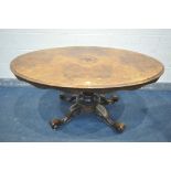 A VICTORIAN BURR WALNUT BREAKFAST TABLE, on a scrolled base, length 147cm x depth 106cm x height